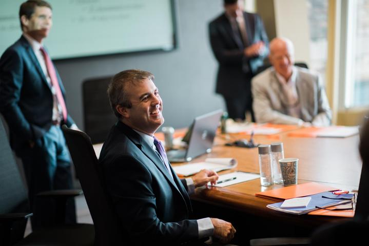 SkyView Partners empolyee in staff meeting